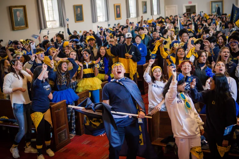 Students cheering during Peddie's Blue and Gold Chapel