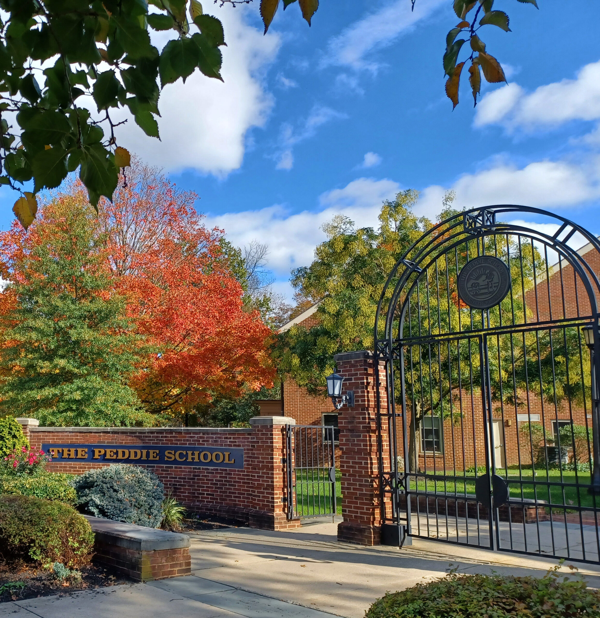 The Peddie School gates with bright colored fall foliage