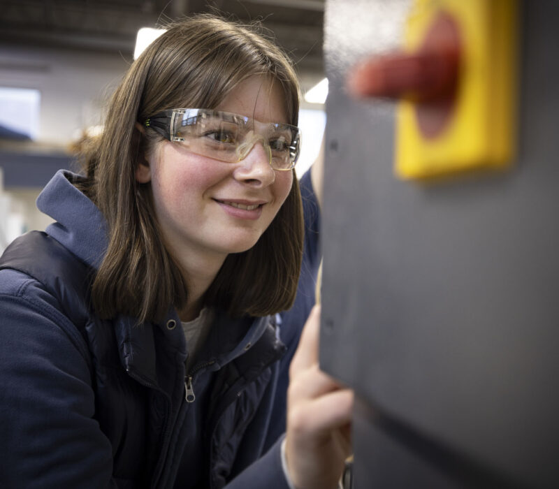 Girl working with machinery