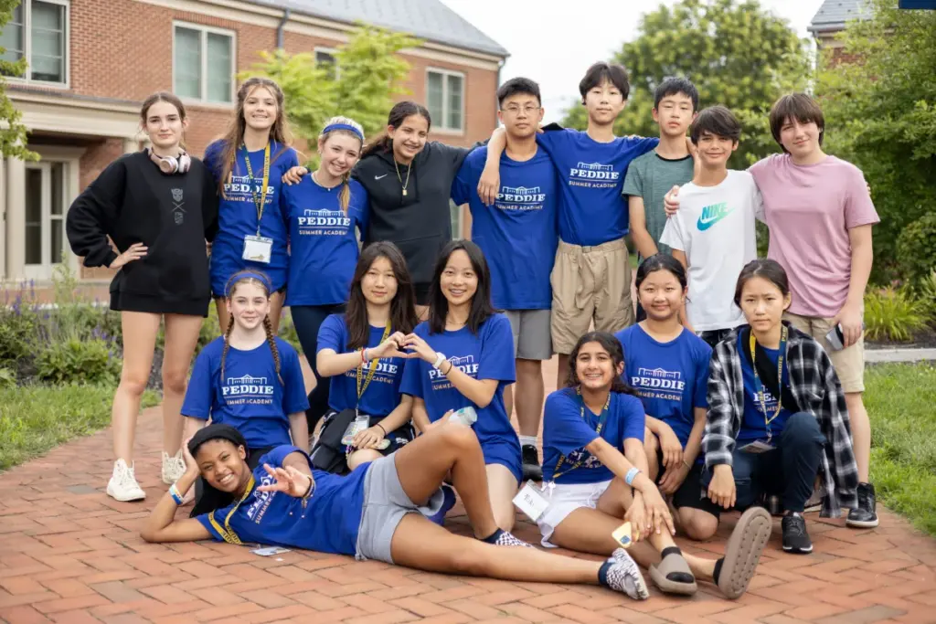 Middle school students posed outdoors at Peddie Summer Academy