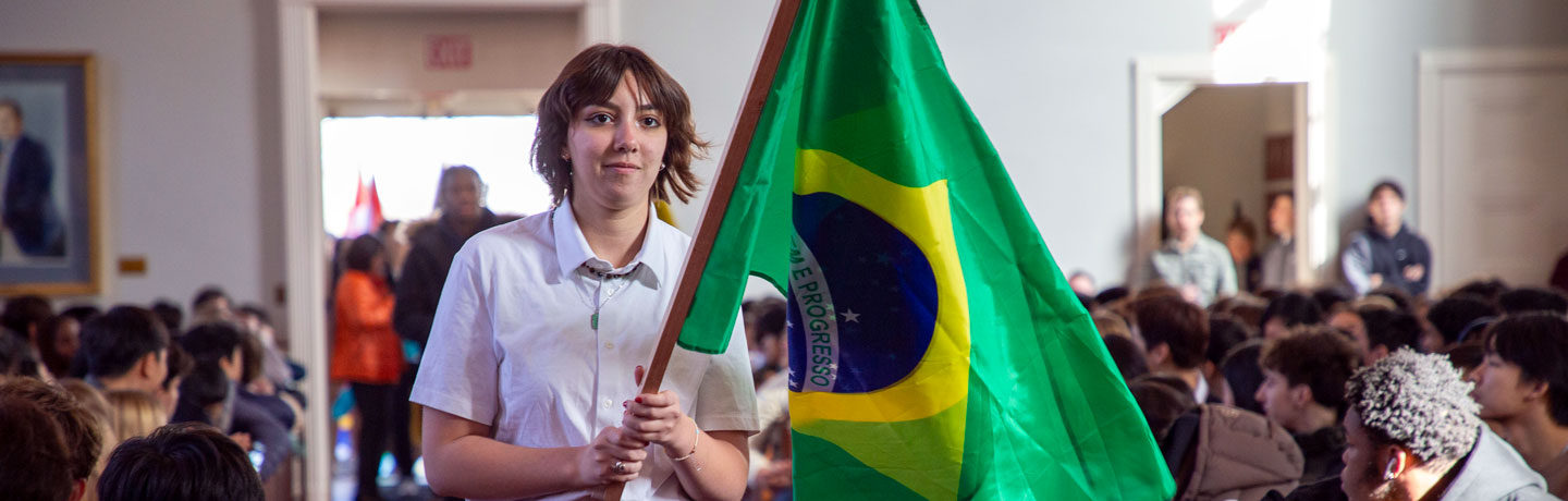 Peddie students participate in the parade of flags during International Week chapel
