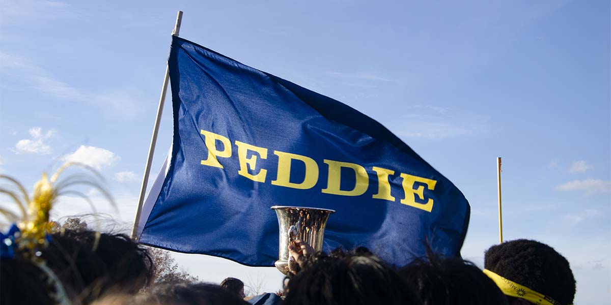 kelley-potter cup against the peddie flag