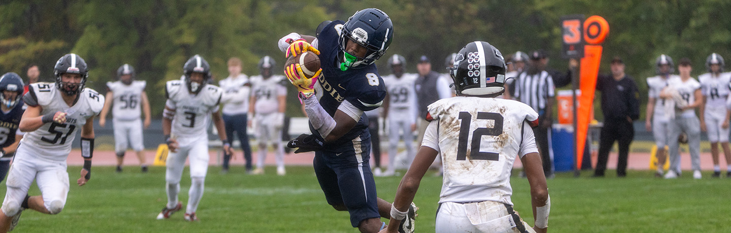 A Football Player Makes An Acrobatic Catch