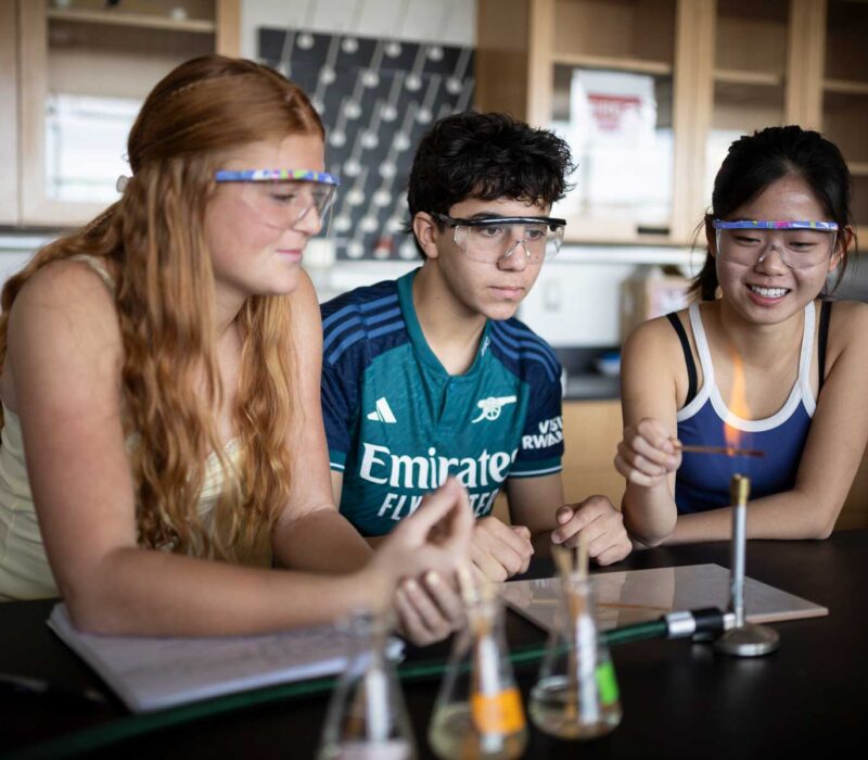 Students using Bunsen Burner in a science lab at The Peddie School