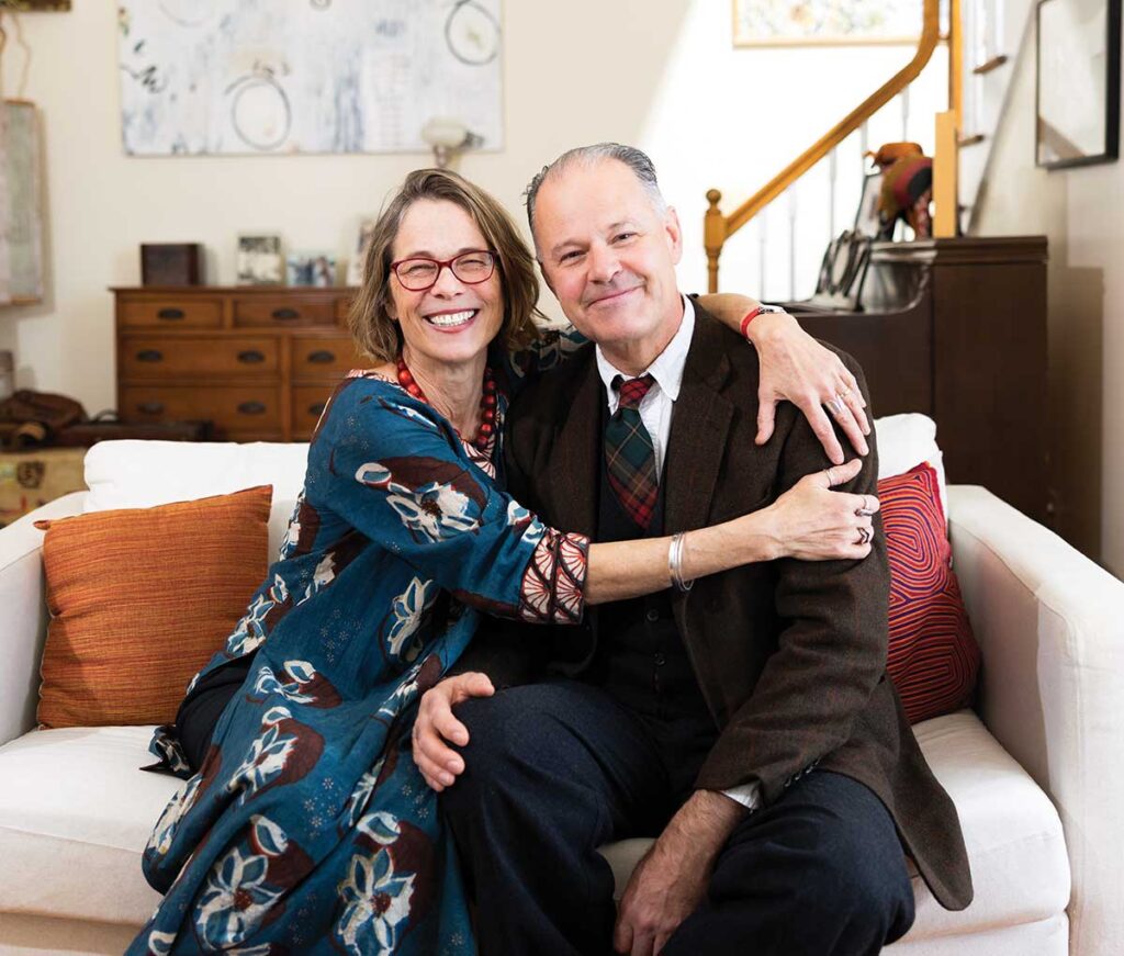 Cathy and Paul Watkins, seated at their Octagon House home on campus, said they look forward to relocating to their lakeside home in Northwest Maine.