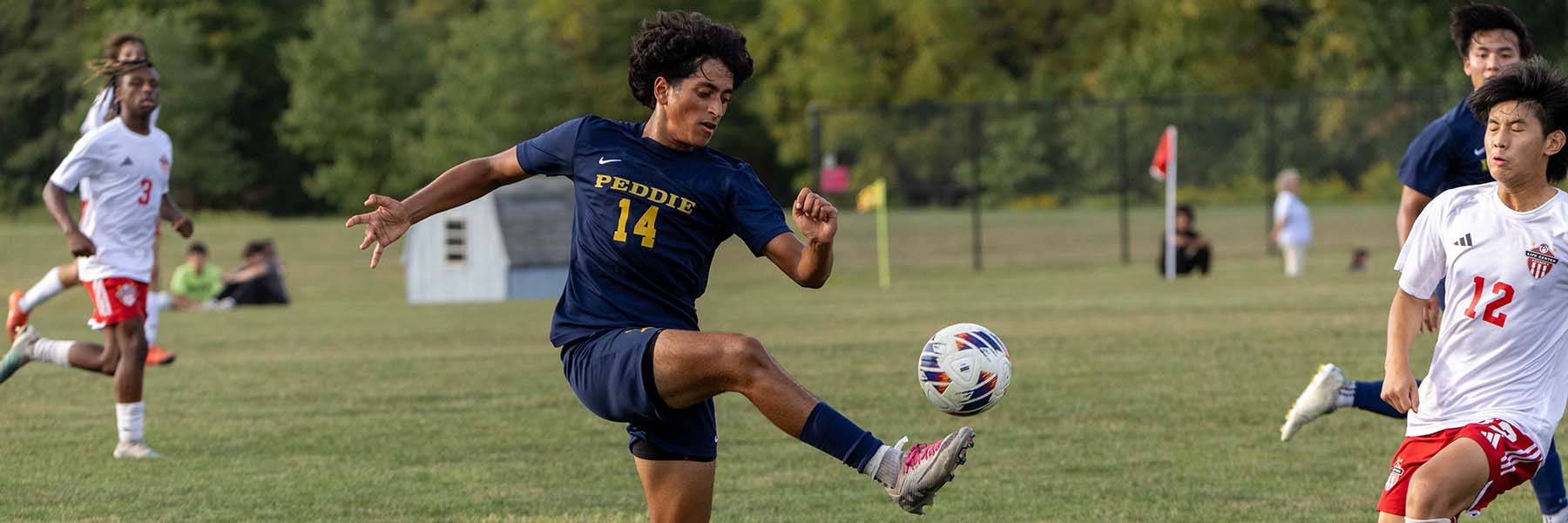 Rayyaan Mohiuddin kicks the soccer ball