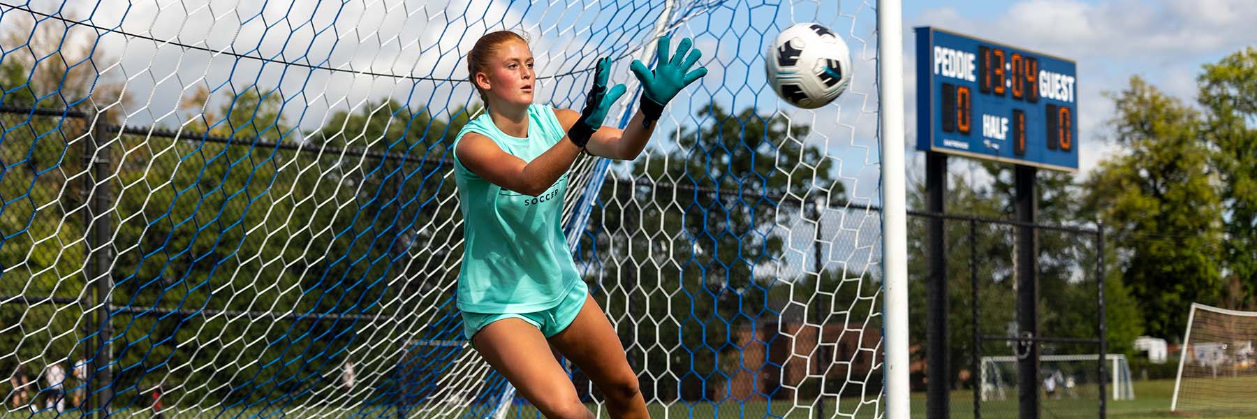 Goalkeeper Sadie Lawrence makes a save