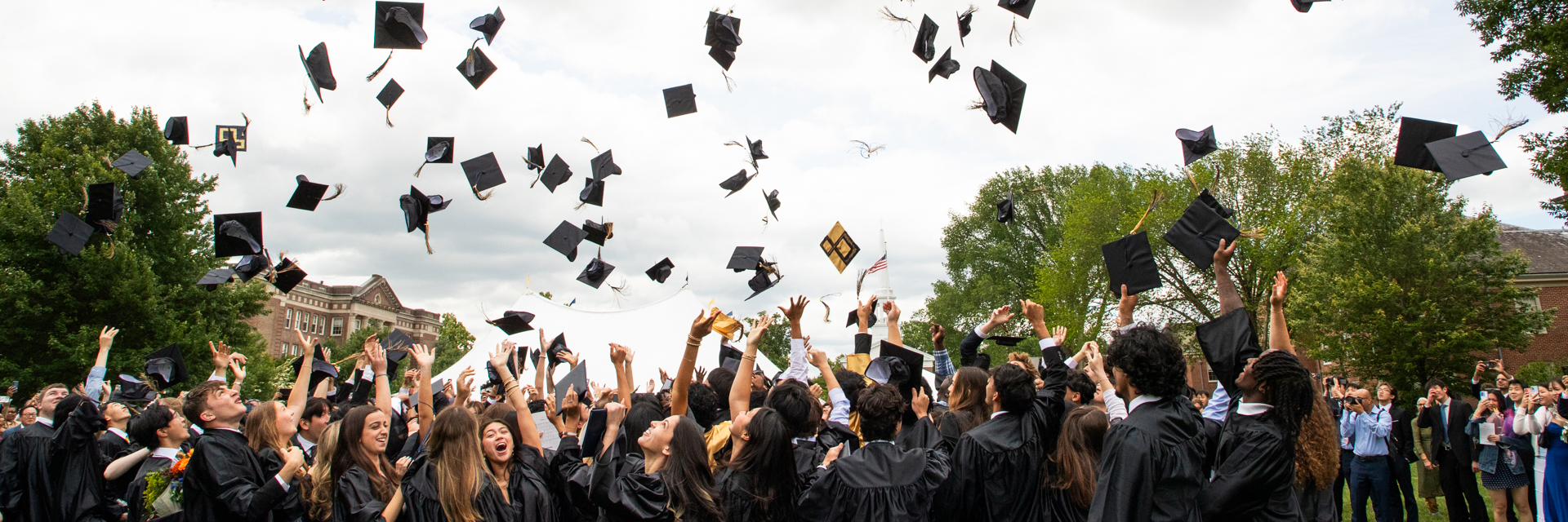 class of 2025 throwing their caps in the air