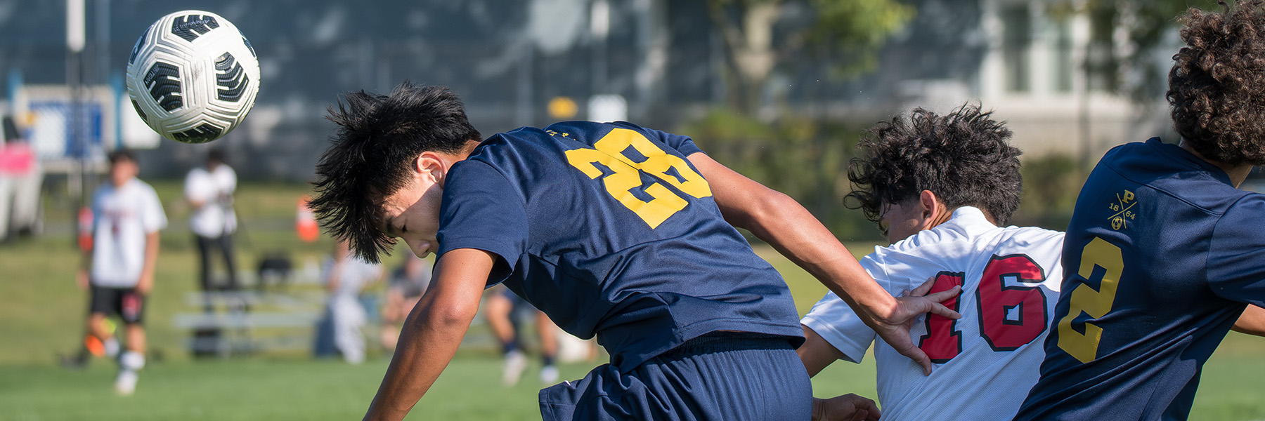 A Boys Soccer Player Directs A Header