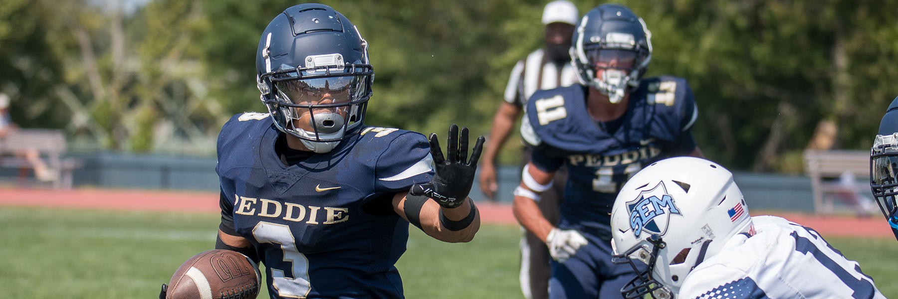 Jeremiah Davis runs with the football
