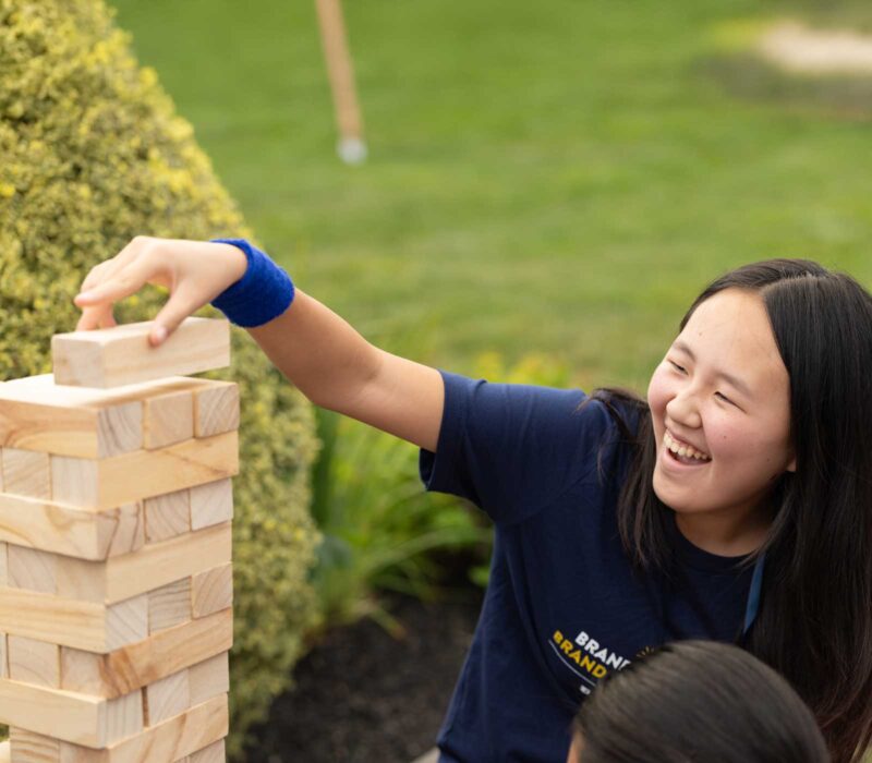 Peddie student playing giant Jenga