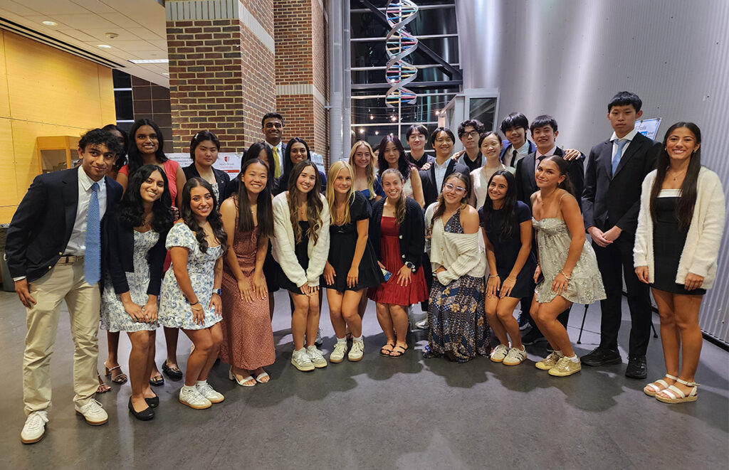 students posing together in the Science Center