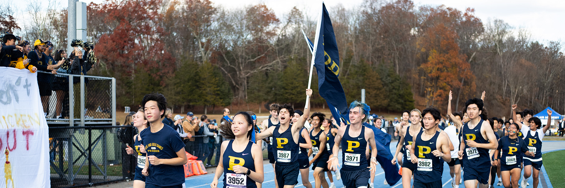 The Peddie boys cross country team and Peddie girls cross country teams celebrate Peddie-Blair Day victories at Blair Academy.